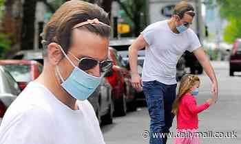 Bradley Cooper wears his daughter's pink headband in his hair
