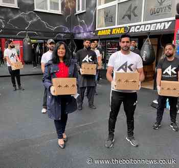 Amir Khan and Yasmin Qureshi packs food boxes for Bolton families - The Bolton News