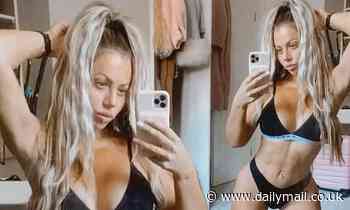 Holly Hagan flaunts her hourglass curves as she poses in skimpy black underwear