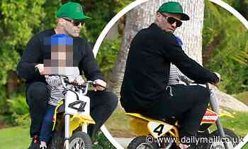 Jason Statham is every inch the doting father as he enjoys a bike ride with his son Jack, 2, in LA