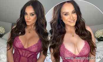 Vicky Pattison poses in a pink ] semi-sheer lace bodysuit