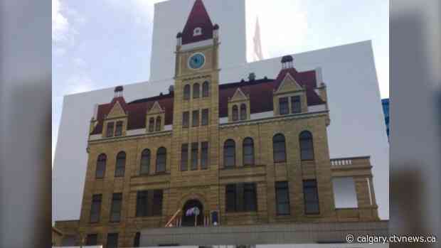 City hall's exterior sandstone repairs near completion, wrapping to be removed early summer