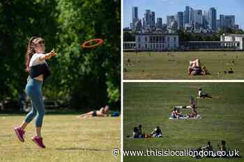 People enjoy socially-distant sunbathing in Greenwich Park on hottest day of the year