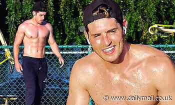 Gregg Sulkin looks hunky as he strips off his shirt during a socially distanced workout at the park