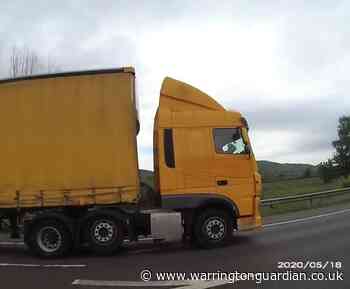 M56 lorry driver caught reading notes while resting hands on steering wheel