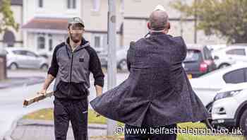 Man charged over incident which saw officer pull gun during Belfast house confrontation