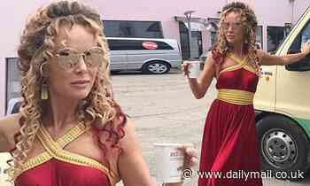 Amanda Holden looks radiant as she shares throwback snap of herself in red and gold Roman gown