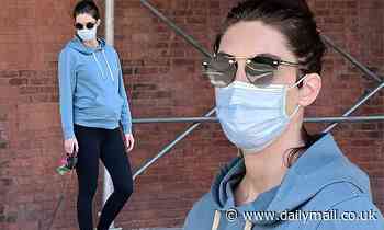 Hilary Rhoda shows off baby bump in blue hoodie as she takes dog for walk in NYC during quarantine