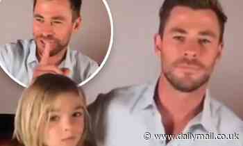 Chris Hemsworth is distracted by his cheeky son after he interrupts his dad's radio interview - Daily Mail