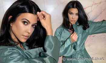 Kourtney Kardashian sets pulses racing as she poses in sister Kylie Jenner's pink marble shower