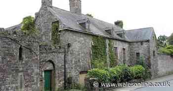 In an abandoned, crumbling Tudor building in the heart of Laugharne