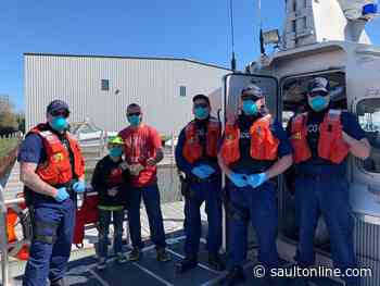 Coast Guard Station St. Ignace saves two persons in the Cheboygan River
