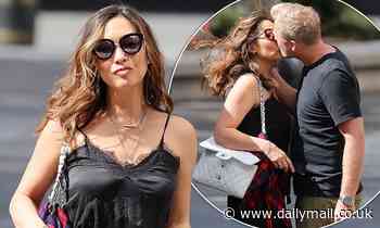 Myleene Klass shares a smooch with boyfriend Simon Motson as she arrives at Global Radio