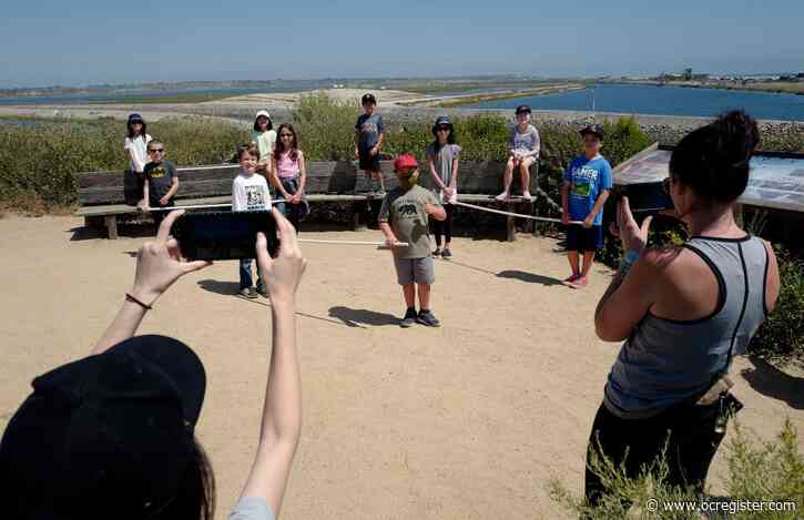 A small Huntington Beach class takes a socially distanced field trip