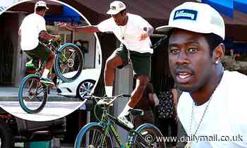 Tyler The Creator shows off his impressive bike skills as he rides around Venice
