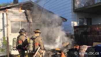 Police remove 'unco-operative and threatening' person from burning Saskatoon home