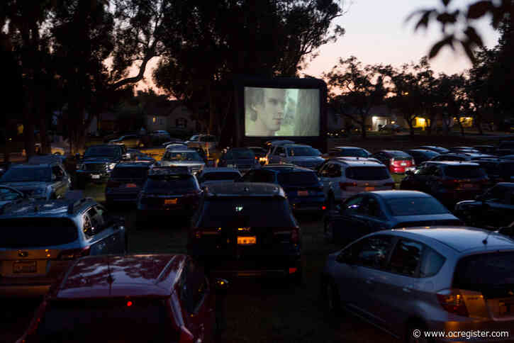 Safe under the stars, moviegoers enjoy a flick