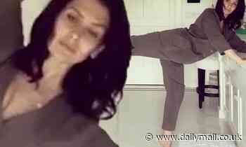 Hilaria Baldwin performs a quick leg workout in her bathroom