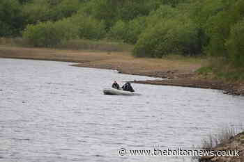 Search teams spend second day at reservoir