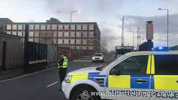 Police cordon off section of road as fire blazes