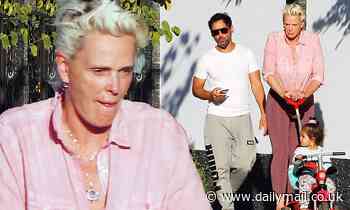 Brigitte Nielsen pushes daughter Frida, one, on a tricycle during sunny family outing