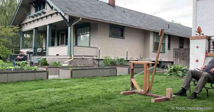 Watch two neighbors make the most of social distancing with a beer catapult