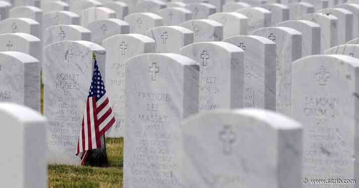 A swastika adorns a gravestone at a Utah military cemetery. Members of Congress want it removed.