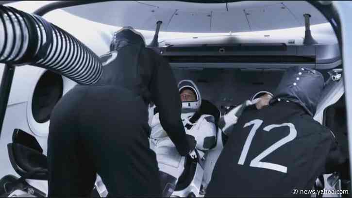Astronauts strap into SpaceX capsule before launch day