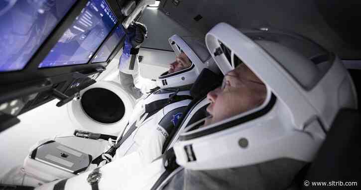 NASA astronauts go back to the future with capsule launch