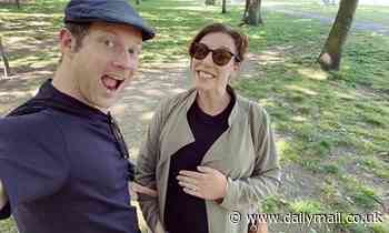 Dermot O'Leary points excitedly at pregnant wife Dee's blossoming bump during sunny walk in the park