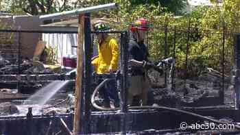 Fresno firefighters battle grass fire in Central Fresno