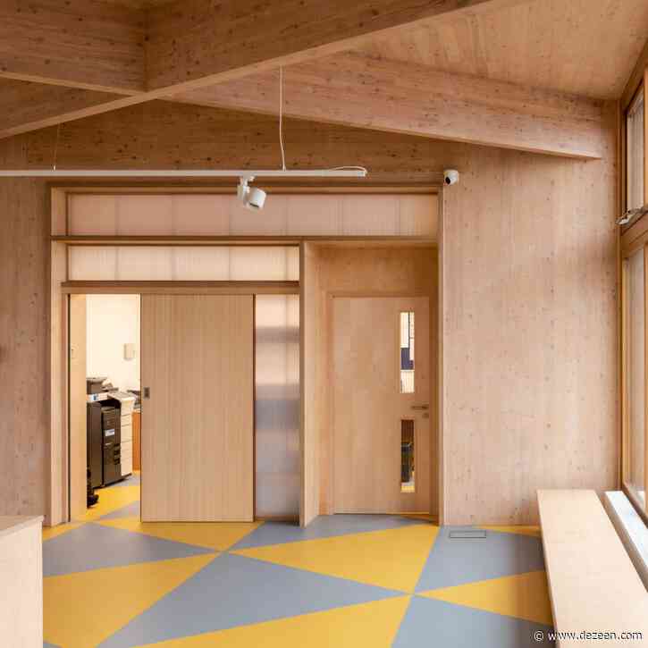 DK-CM unites post-war and 1990s schools with CLT reception pavilion