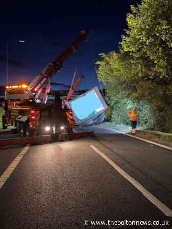 M61 closed overnight as lorry overturns and spills load