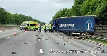 Horrifying moment car ploughed into by lorry and driven into bushes on M1