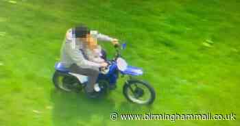 Reckless biker with toddler perched on his lap arrested