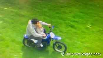 Shocking image shows father riding bike with child allegedly balanced on lap