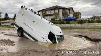 City of Saskatoon van slides into sinkhole caused by water main break