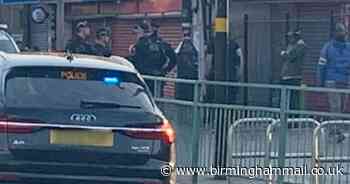 Armed police reported on city street