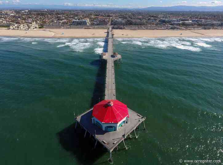 Iconic Huntington Beach Pier reopens to public, but keep moving