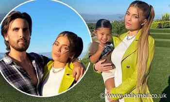 Kylie Jenner rocks trench coat over figure-hugging white mini dress for photo with daughter Stormi