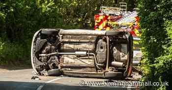 Car overturns after crash with fire engine