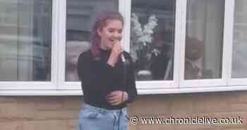 See teen of key worker family singing to neighbours at Clap for Carers