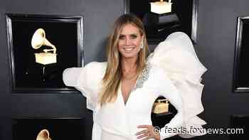 Heidi Klum sunbathes nude with just diamond necklace in backyard