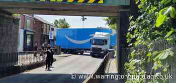 Amazon lorry crashes into railway bridge over Orford Road