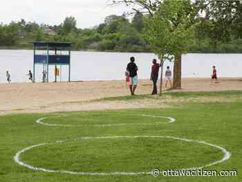 City paints physical distancing circles at Mooney's Bay