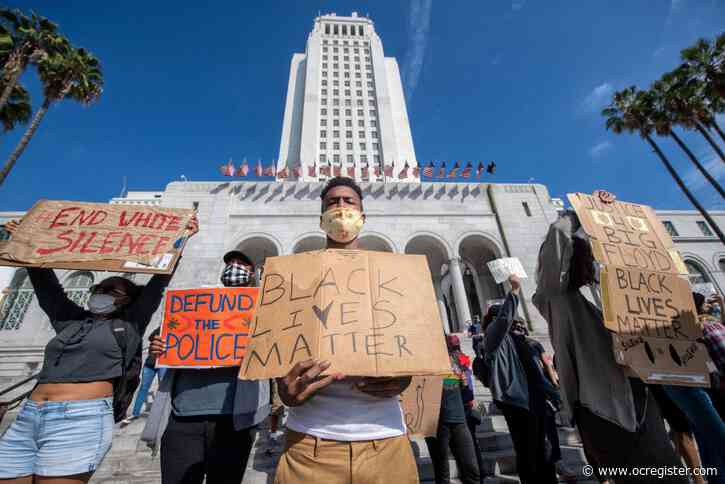 Protesters march Friday in Los Angeles, shut down 110 Freeway,  amid growing anger nationwide over George Floyd’s death