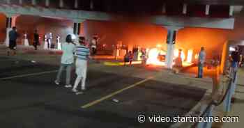 Fires burn along Lake Street as thousands ignore curfew