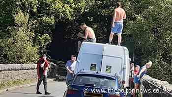 PHOTO: People jump from bridge into Yarrow Reservoir, Rivington