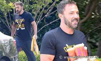 Ben Affleck smiles as he gets breakfast delivered from Dunkin' Donuts during quarantine