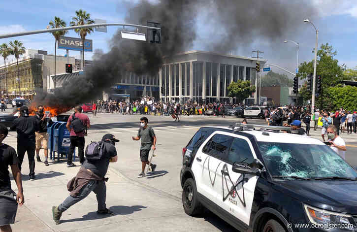 LAPD declares unlawful assembly in Fairfax area as police cruiser burns on 4th straight day of protests